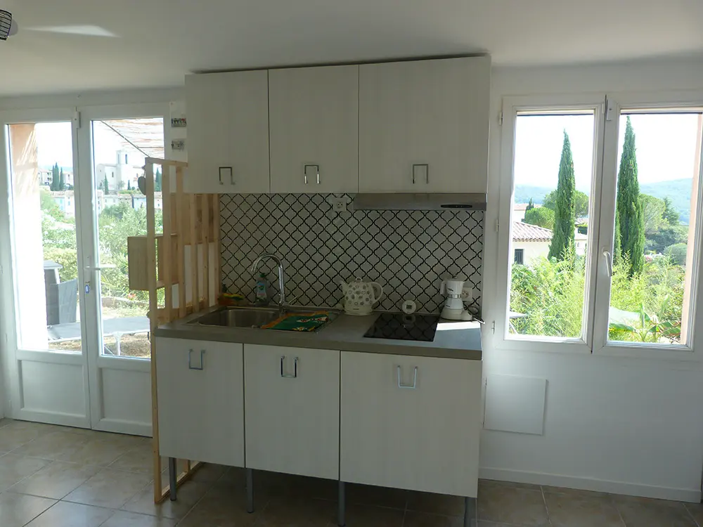 Kitchen with kettle, coffee maker, dining table, microwave grill, refrigerator, kitchen utensils, crockery/cutlery, electric barbecue