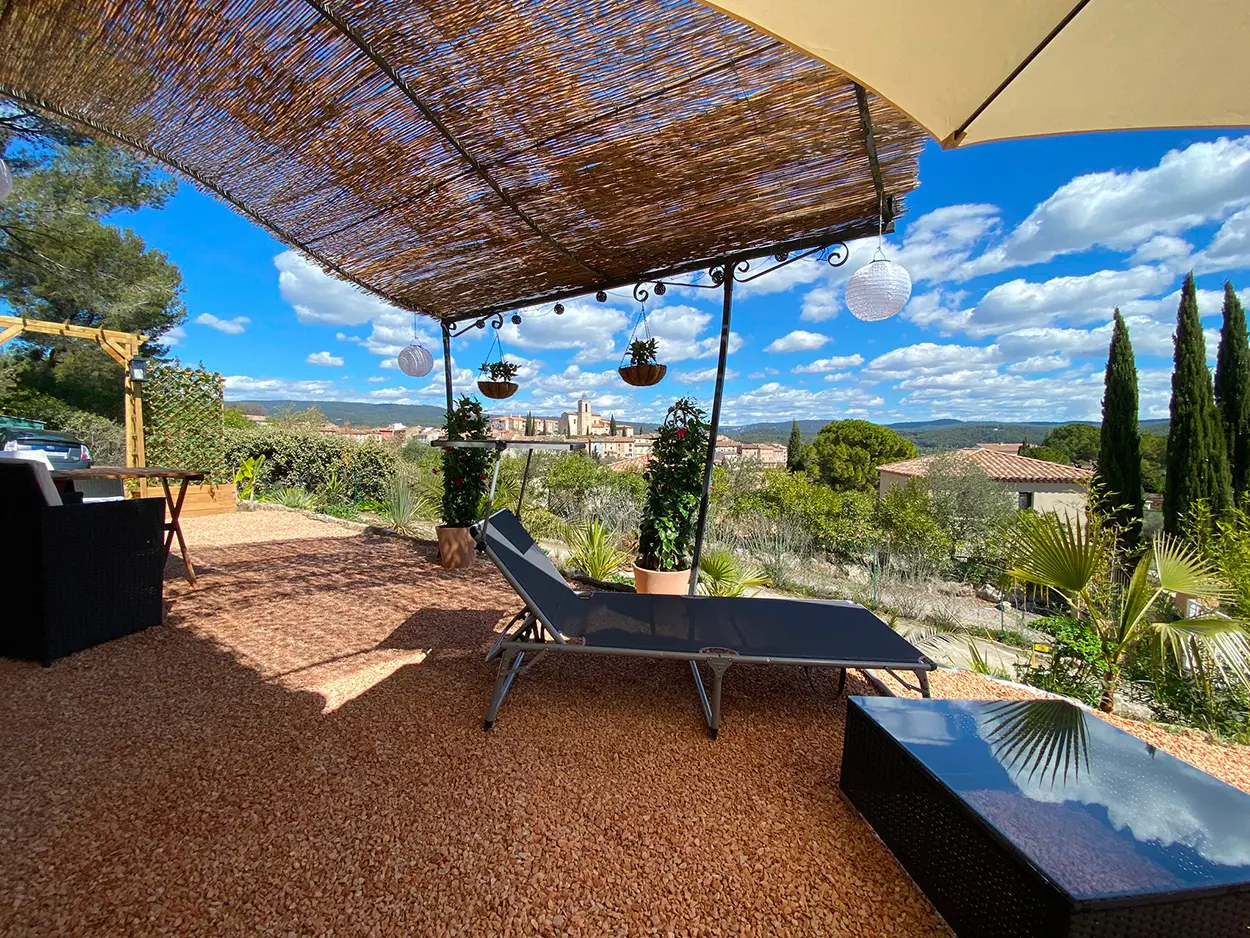 Deckchairs, table, chairs on the terrace to relax